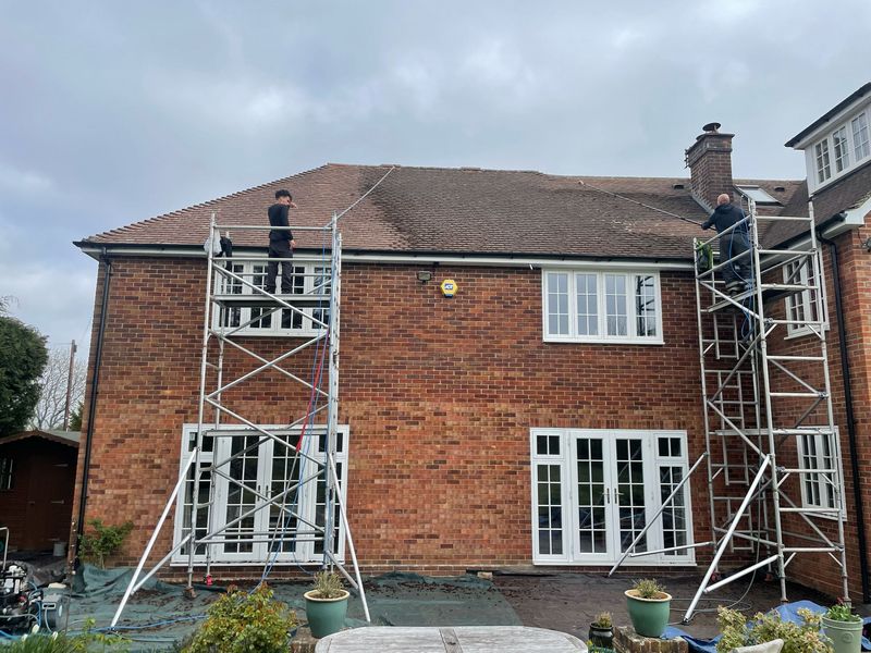Roof cleaning carried out safely from scaffold towers by The Roof Moss Cleaners in Shefford